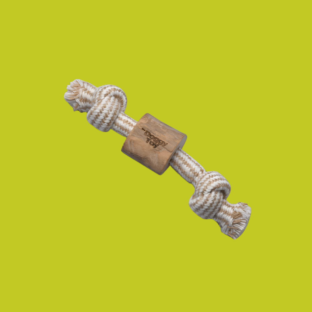 A beige dog toy made of a natural material, featuring a rope-like texture and a wooden block.